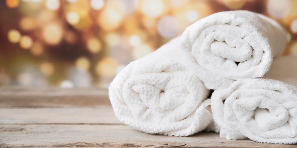 three rolled up towels